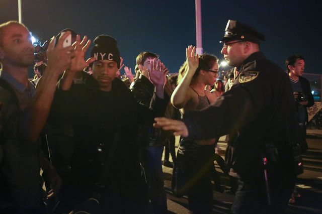 About 250 people took the roadway of the Robert F. Kennedy Bridge at about 12:15 am, followed by scores of police.<br/>